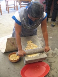 oaxaca woman grinding corn